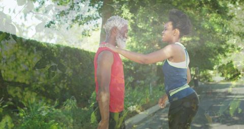 African American Couple Stretching Outdoors for Fitness