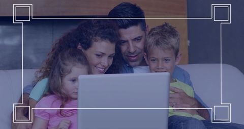 Family gathering on couch watching laptop together for home entertainment and bonding