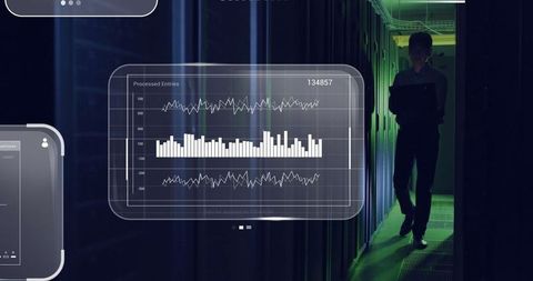 IT Admin Monitoring Data Center Servers with Digital Analytics Display