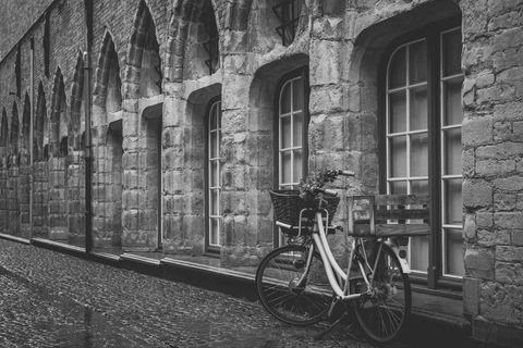 Vintage bicycle outside historic stone building