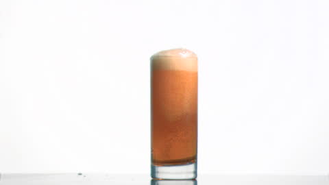 Effervescent Beer Overflowing in Slow Motion