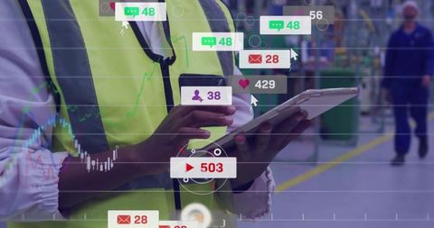 Warehouse Supervisor Analyzing Data on Tablet with Digital Overlays
