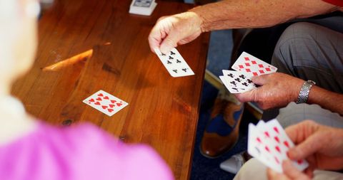 Seniors Playing Cards Together at Communal Table - Download Free Stock Images Pikwizard.com