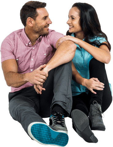 Transparent happy couple sharing loving glances while sitting