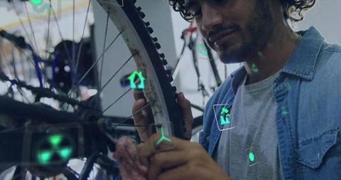Technician Maintaining Bicycle Wheel with Augmented Reality Icons