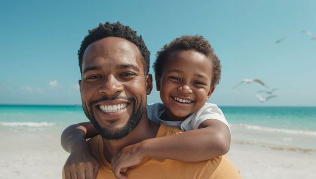 Father Giving Son Piggyback Ride on Sandy Beach