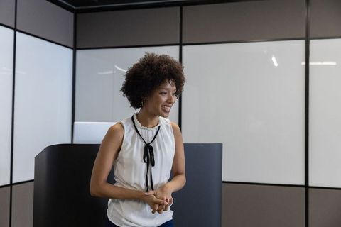 Confident Woman Presenting at Business Conference