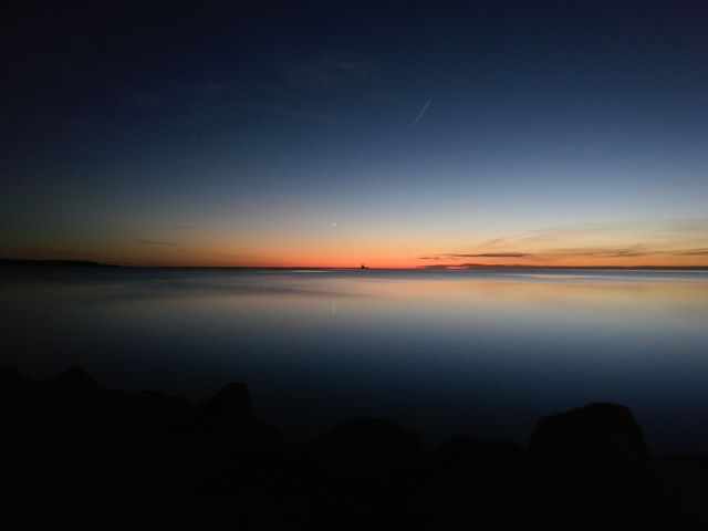 Stunning Seascape with Orange and Blue Sunset - Download Free Stock Photos Pikwizard.com