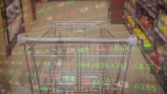 Overlaying financial data graphics on a shopping cart represents the integration of economics with consumer behavior, showcasing visualization for global economic studies and market researchers. This can be used in presentations or articles discussing retail industry trends, finance reporting, e-commerce impacts, and market analysis projects.