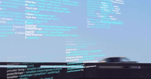 Silver sedan crossing highway overlaying translucent code projection and motion blur