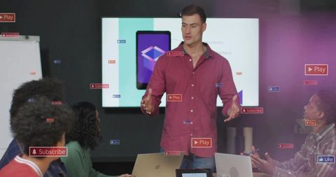 Presenter presenting to team with digital display and social media overlays in modern office