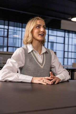 Businesswoman engaging in meeting in modern office environment