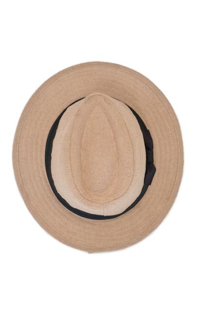Overhead view of beach hat on white background