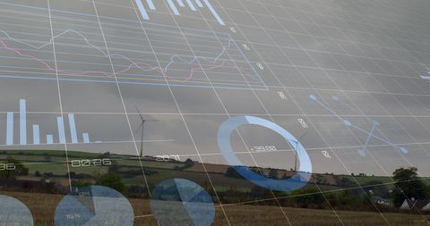 Data analytics overlay with wind turbines bckground represents green technology
