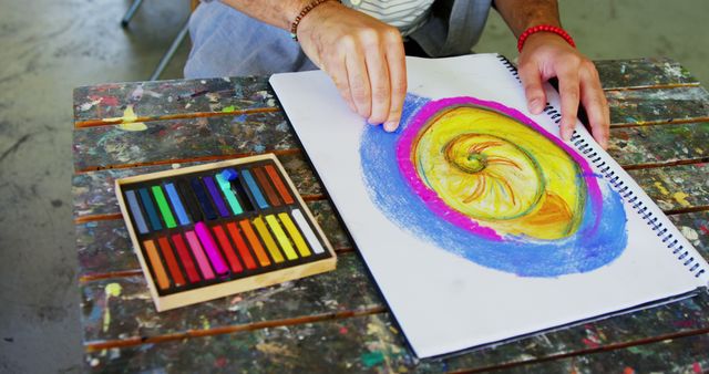 Artist Drawing with Colorful Pastels on Sketchbook - Download Free Stock Images Pikwizard.com