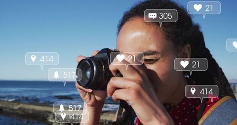 Influencer capturing coastal scenery with rising social media alerts
