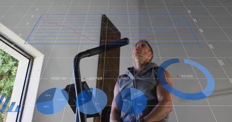 Pedaling male on elliptical with digital fitness data overlay for home cardio performance