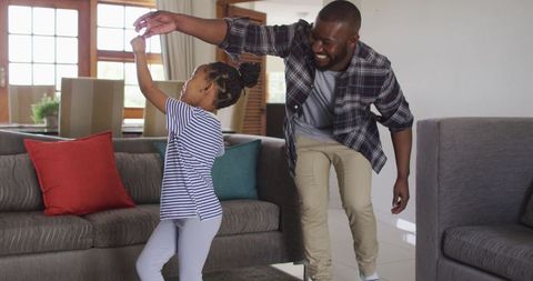 Father and Daughter Enjoying Dance at Home