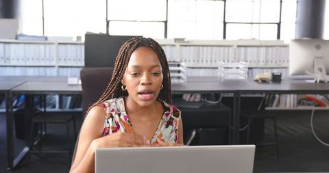 Confident African Woman Engaging in Remote Work Meeting - Download Free Stock Images Pikwizard.com