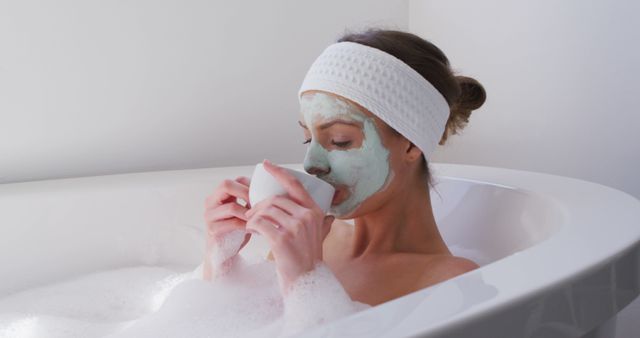 Woman Relaxing in Bathtub with Facial Mask and Tea - Download Free Stock Images Pikwizard.com