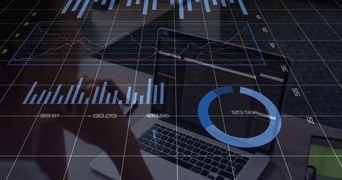 Business Professional Analyzing Data on Laptop with Digital Overlay
