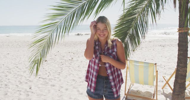 Smiling Woman Relaxing on Beach in Casual Summer Outfit - Download Free Stock Images Pikwizard.com