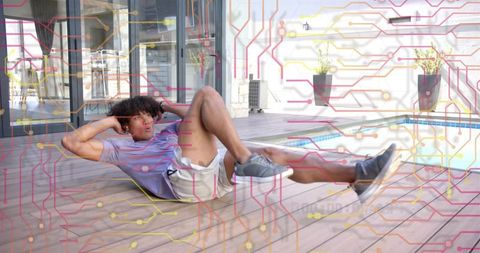 Man performing bicycle crunches on poolside deck with technology circuit-board overlay