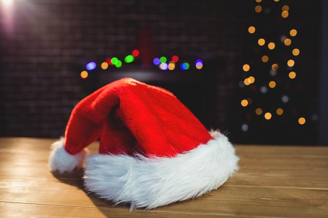Santa hat on wooden plank during christmas time