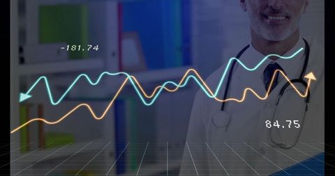 Doctor analyzing medical line graphs in clinic