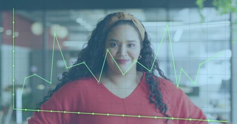 Confident businesswoman analyzing financial data in office
