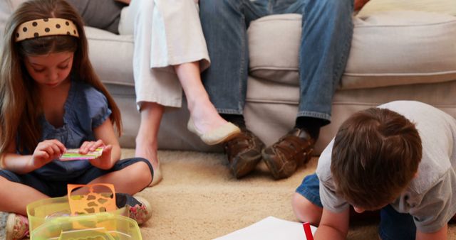 Children Playing with DIY Crafts While Parents Sitting on Couch - Download Free Stock Images Pikwizard.com