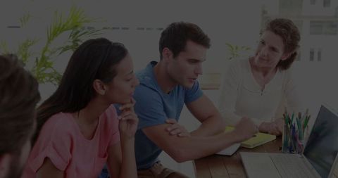 Team collaboration: colleagues brainstorming in modern office meeting