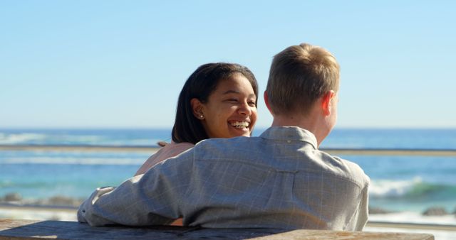 Interracial Couple Embracing by Ocean on Sunny Day - Download Free Stock Images Pikwizard.com