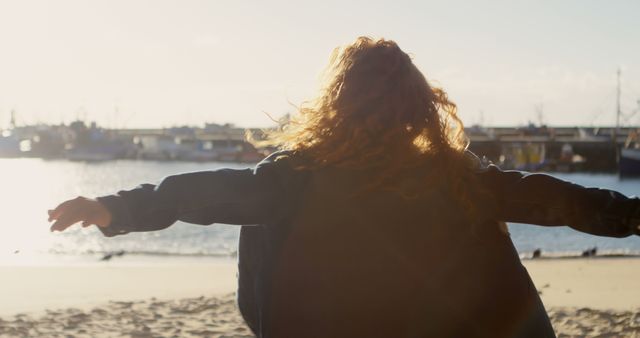 Woman Enjoying Sunset at Beach with Open Arms - Download Free Stock Images Pikwizard.com