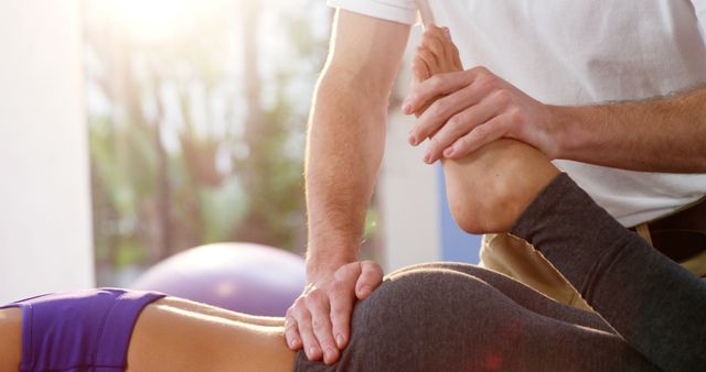 Physiotherapist Stretching Patient's Leg During Therapy Session - Download Free Stock Images Pikwizard.com