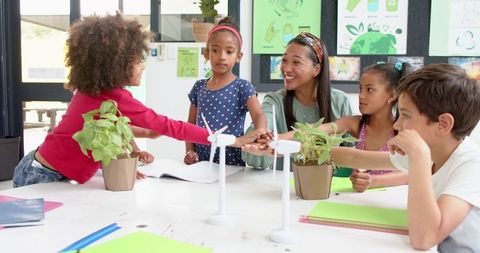 Teacher and Students Discussing Renewable Energy Projects