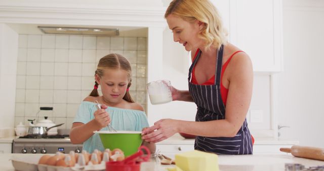 Mother and Daughter Baking Together in Kitchen, Bonding and Baking Fun - Download Free Stock Images Pikwizard.com