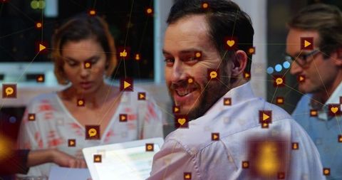 Digital Networking Icons Overlay on Business Meeting