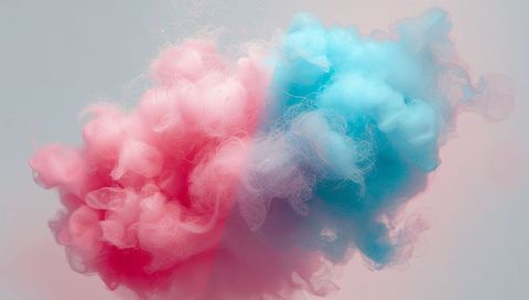 Floating pink and blue smoke plumes intertwining into pastel duotone cloud