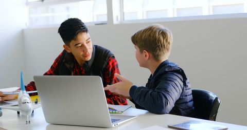 Young Students Engaging in Peer Learning with Technologies in Classroom - Download Free Stock Images Pikwizard.com
