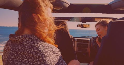 Friends Enjoying Scenic Road Trip by the Ocean