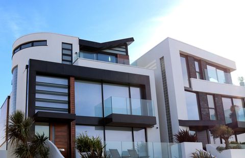 Modern Luxury Home Exterior with Glass Balconies