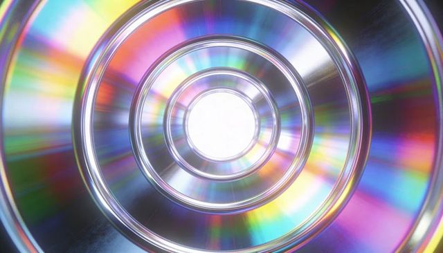 Iridescent compact disc macro showing concentric rings, central hole and rainbow diffraction