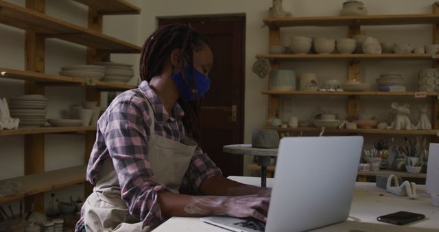 African American Pottery Artist Using Laptop in Studio Workshop - Download Free Stock Images Pikwizard.com