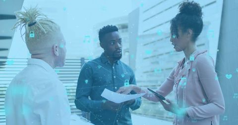 Diverse Professionals Discussing Digital Interface in Office