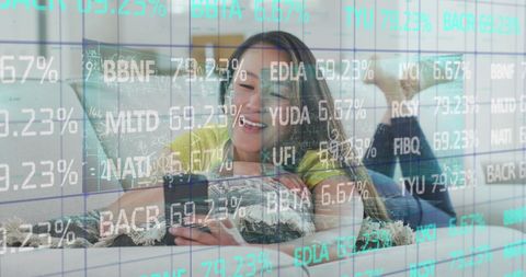 Asian Woman Using Smartphone Amidst Financial Data Graphics
