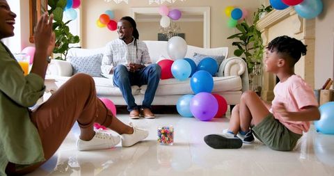 Family Celebrating Birthday with Joyful Moments at Home