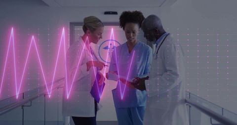Collaborating Medical Team Reviewing Tablet with Magenta ECG Waveform Overlay