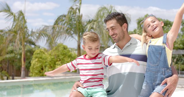 Happy Father Holding Playful Children by Poolside on Sunny Day - Download Free Stock Images Pikwizard.com