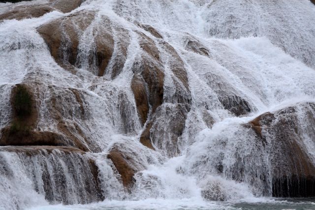 Cascading Waterfalls Flowing Over Rocky Terrain - Download Free Stock Photos Pikwizard.com